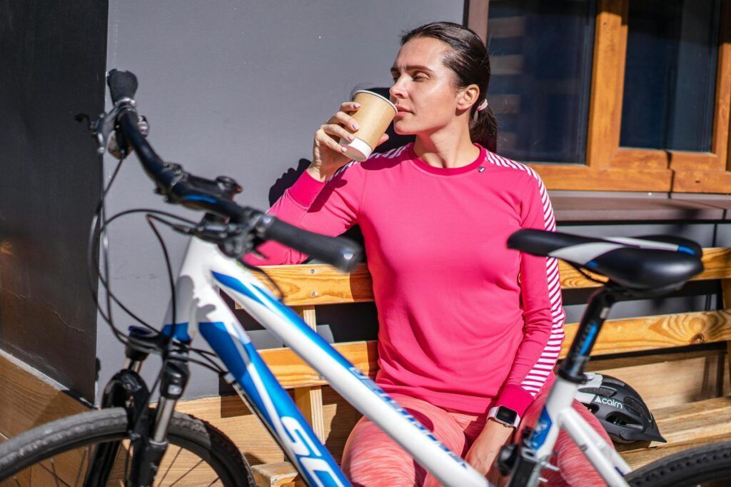 cyclist resting on bench