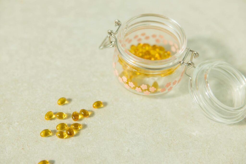 close up shot of food supplement on glass jar